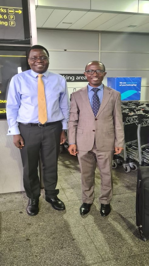 Hon. Ssaalongo Godfrey Kibuuka (left) welcomes Hon. Joseph Kawuki at Gatwick Airport Image